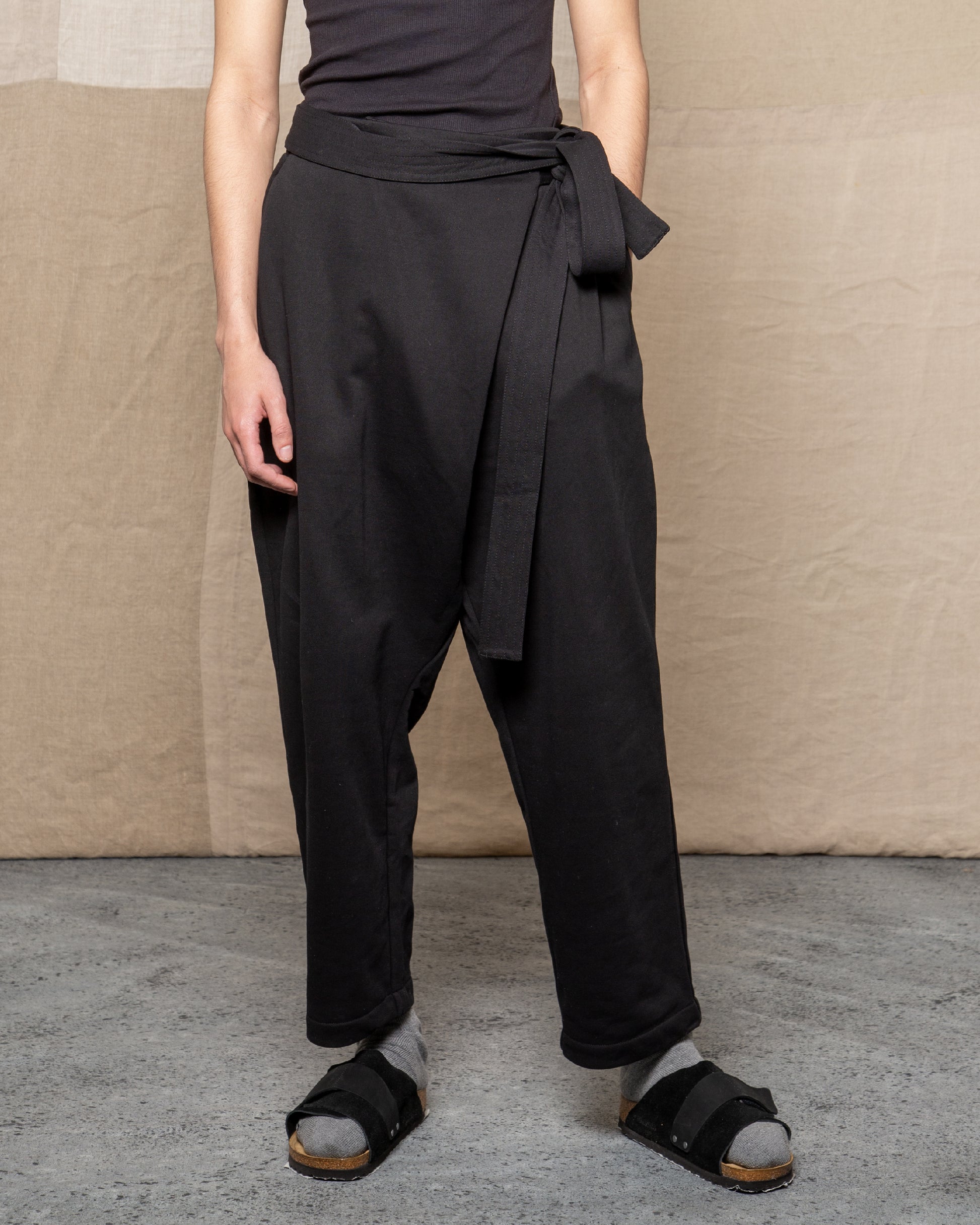 Model is wearing size Small in Black Sarong Pant by Mind Less